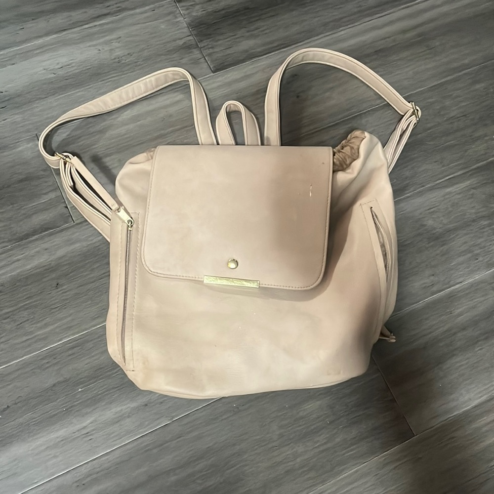 Used light pink mini backpack